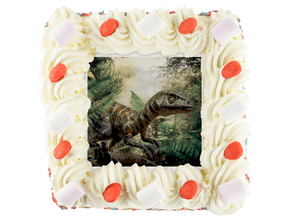 Slagroomtaart met een afbeelding van een dinosaurus